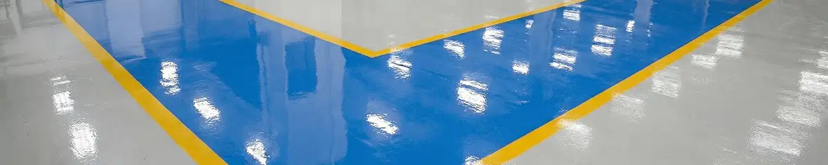 A factory floor professionally covered and marked with epoxy flooring in Eugene, OR