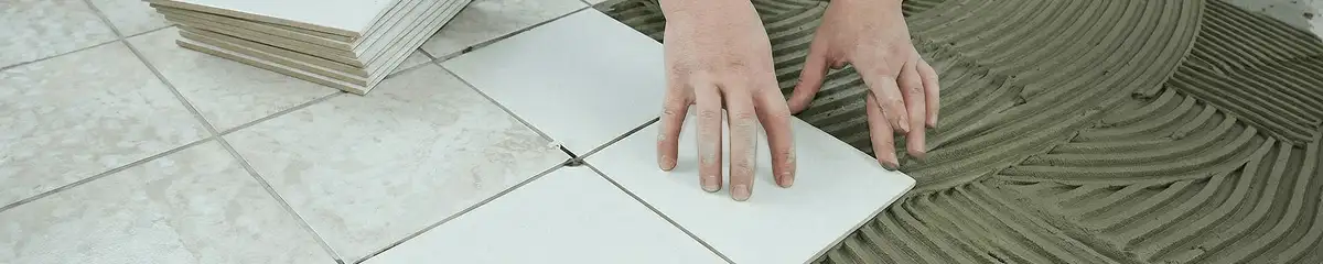 Professional installing white tile floors in Eugene, OR