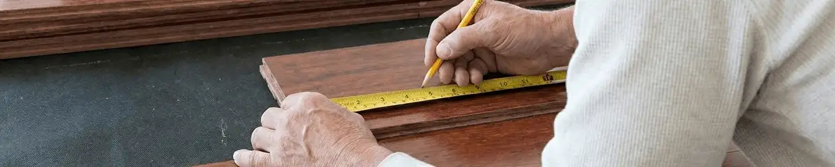 A professional installing wood flooring in Eugene, OR